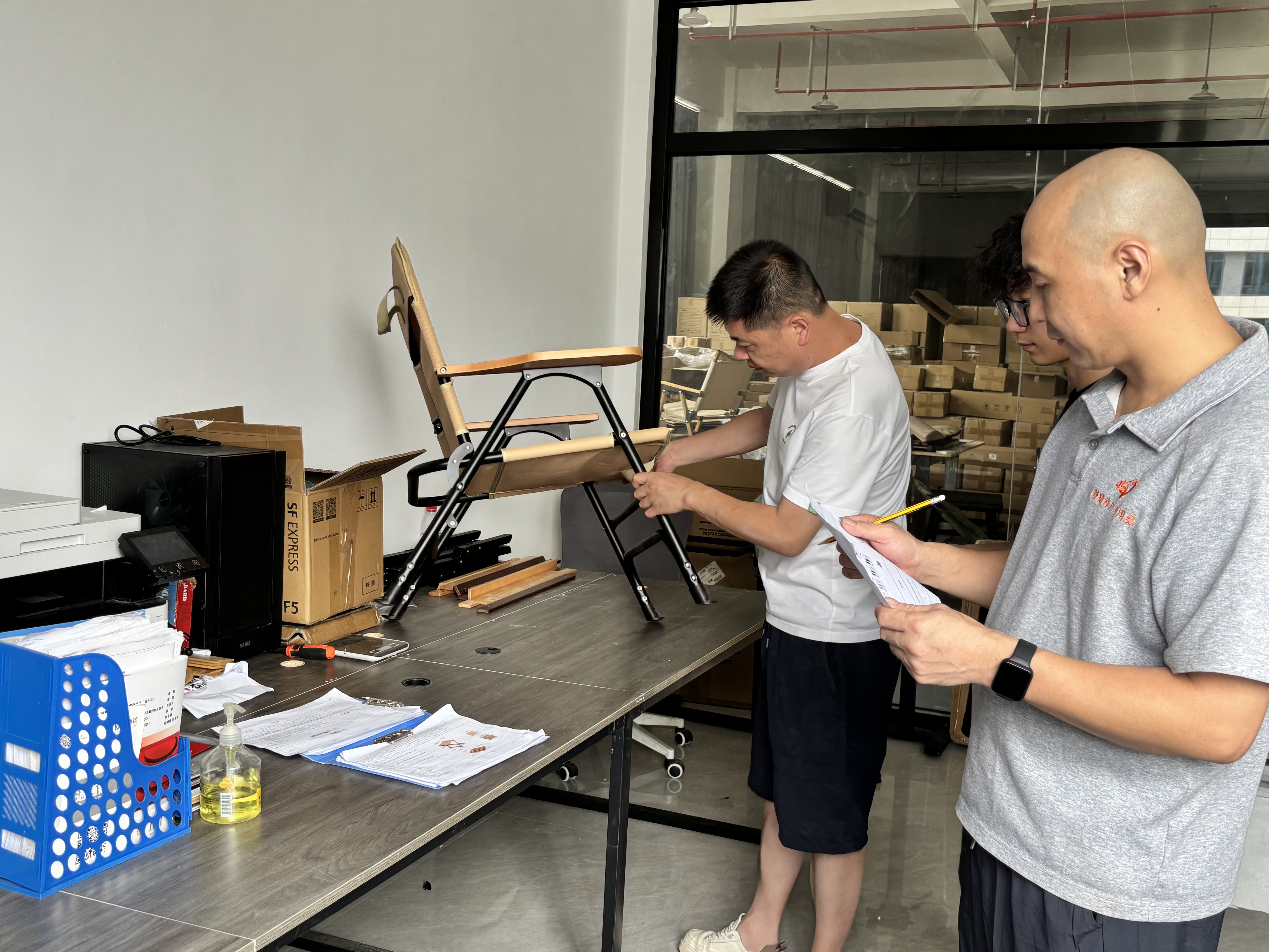 YEZHULIN team inspecting a folding chair